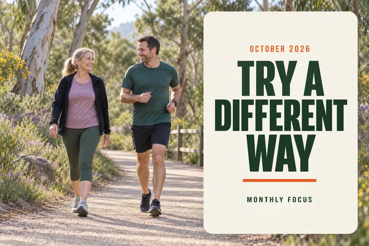 A woman walking and a man jogging along a flowering eucalyptus park path beside the words October 2026: Try a Different Way, Monthly Focus.